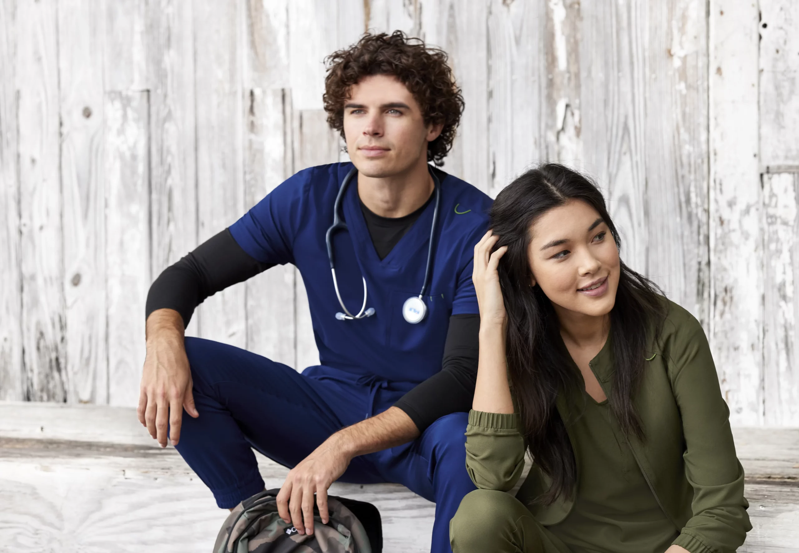 Team of professionals wearing coordinating scrubs and polos