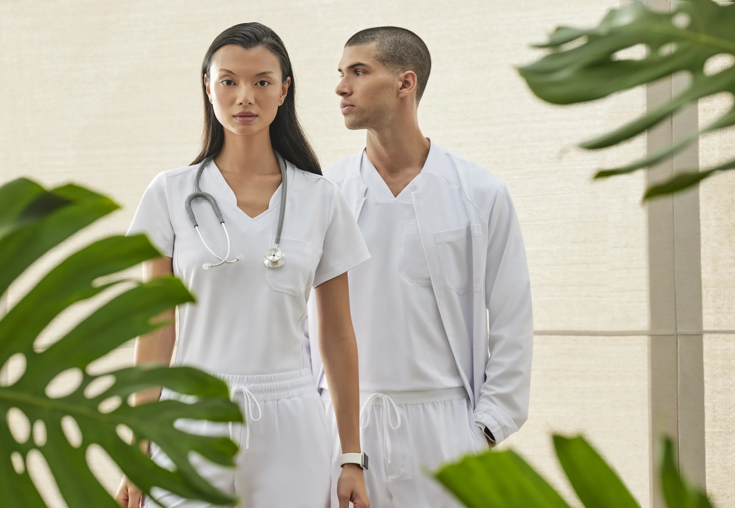Healthcare professionals wearing white scrubs from Discount Uniform Stores